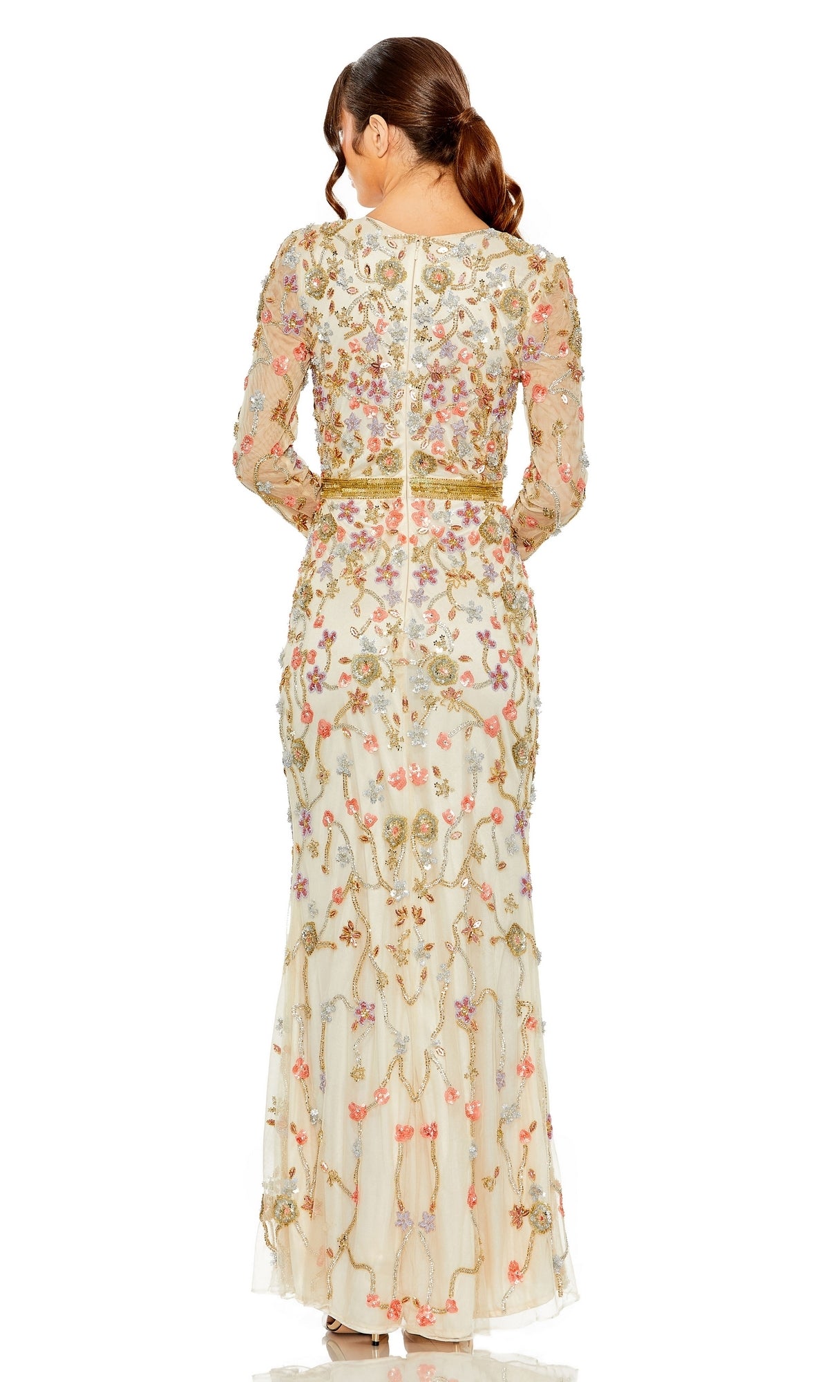 A woman with brown hair in a ponytail is seen from the back wearing the Long Formal Dress 6016 by Mac Duggal, featuring floral beading, sheer long sleeves, and a nude formal design.